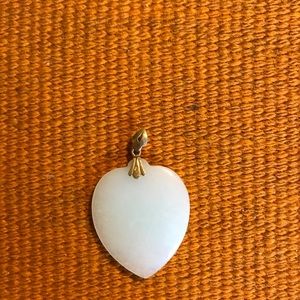 Jade heart pendant with 14k gold detail.
